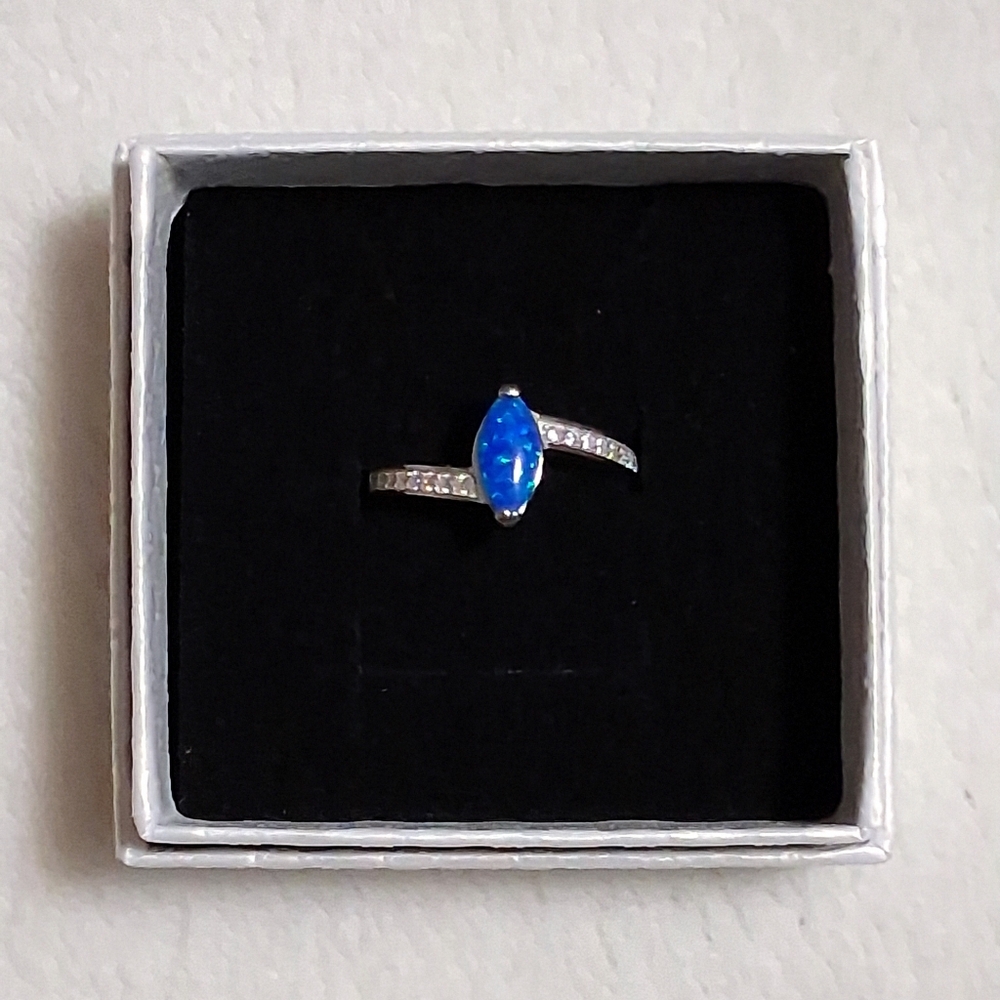 Blue Topaz & AAA CZ'S Set In 925 SS Size 6